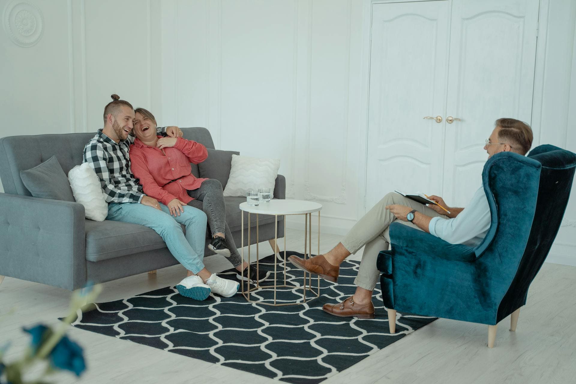 Couple talking with therapist in session